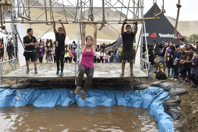 LIMA, PERU - OCTOBER 23, 2016: Inka Challenge, an extreme obstacle course where 1500 athletes from different countries managed to cross the finish line at Santa Maria beach. Challenge in the water. LIMA, PERU - OCTOBER 23, 2016: Inka Challenge, an extreme obstacle course where 1500 athletes from different countries managed to cross the finish line at Santa Maria beach. Challenge in the water.