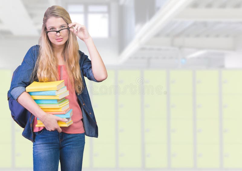 Digital composite of female student holding books in front of lockers. Digital composite of female student holding books in front of lockers