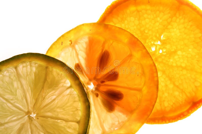 Orange, Lemon and Lime thinly sliced and backlit. Orange, Lemon and Lime thinly sliced and backlit