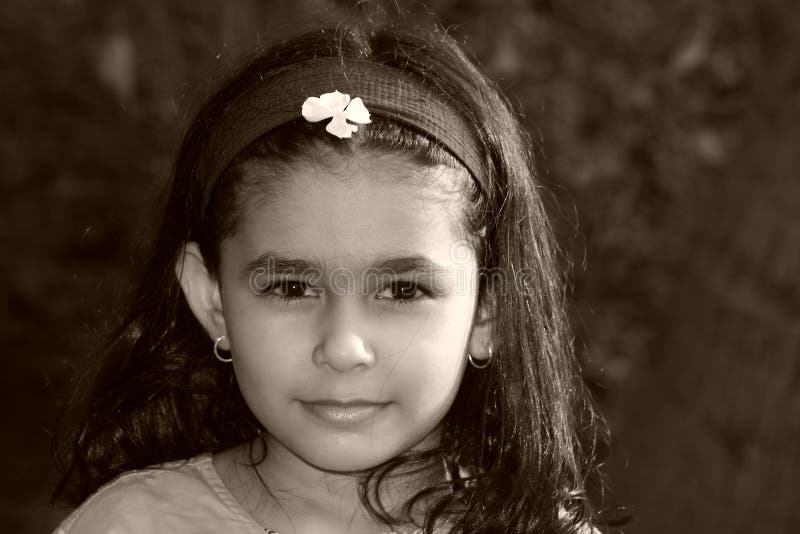 A beautiful face of a girl radiating magical childhood innocence. A beautiful face of a girl radiating magical childhood innocence.
