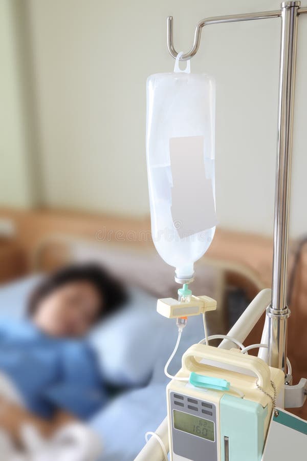 Inpatient on bed with bottle dextrose