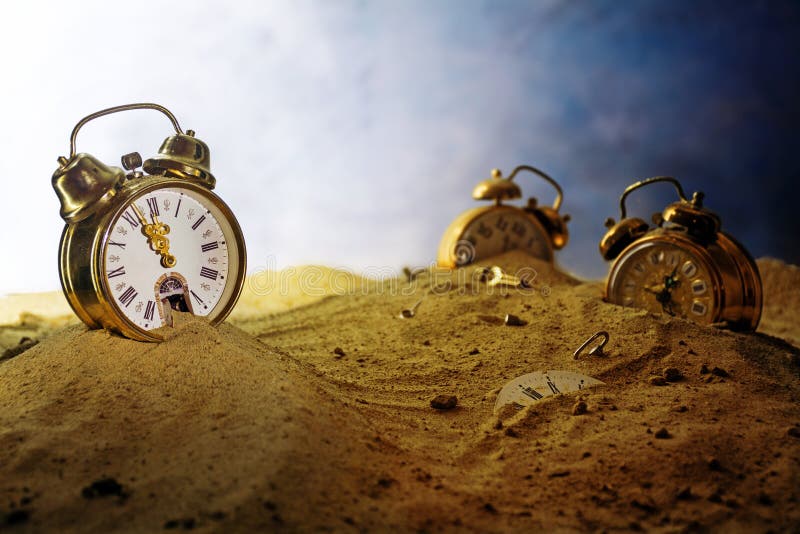 Sand running out of a nostalgic alarm clock, other watches sink into the sand, surreal metaphor in a fantasy landscape, concept of time passes by, eventide or infinity, selected focus, very shallow depth of field. Sand running out of a nostalgic alarm clock, other watches sink into the sand, surreal metaphor in a fantasy landscape, concept of time passes by, eventide or infinity, selected focus, very shallow depth of field