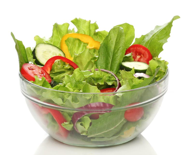 Insalata deliziosa su una ciotola isolata fotografie stock Insalata deliziosa su una ciotola isolata fotografie stock