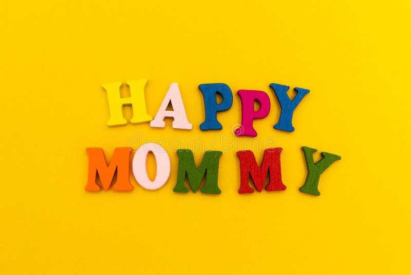 The inscription `Happy Mommy` in colorful letters on a yellow background stock images The inscription `Happy Mommy` in colorful letters on a yellow background stock images