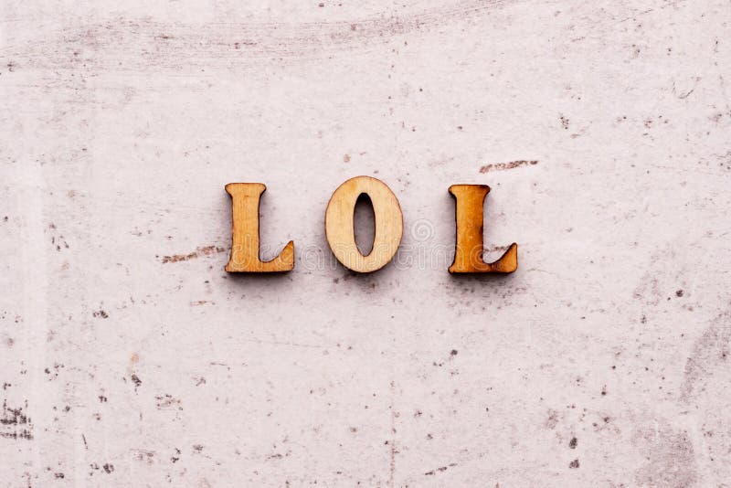 A Pretty Young Teen Happily Holding Rustic Alphabet Blocks With Her  Text-message Abbreviation: LOL (meaning Laughing Out Loud). On A White  Background. Stock Photo, Picture and Royalty Free Image. Image 26610107.