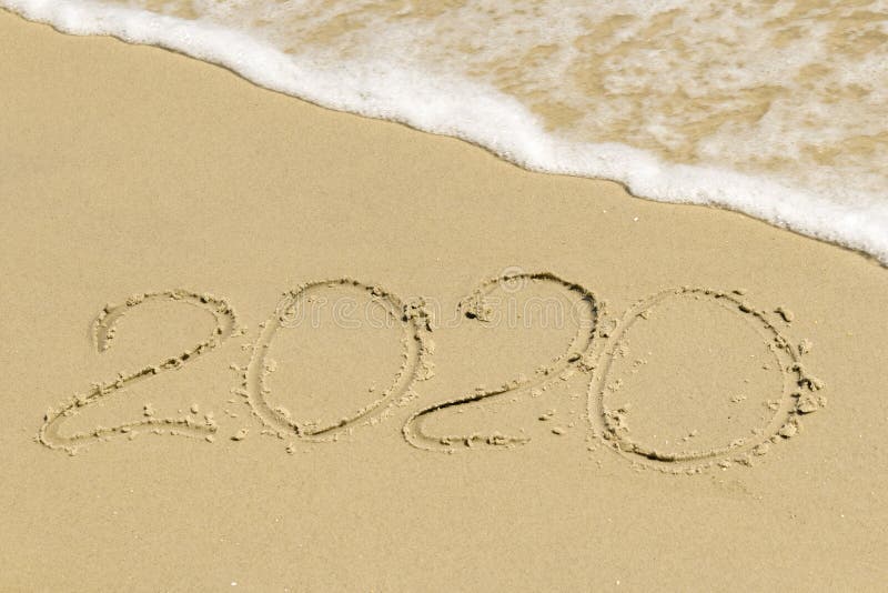 2020 inscription on sand with sea foam royalty free stock images
