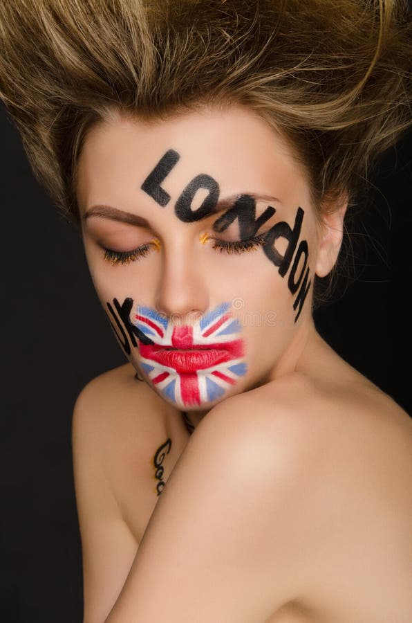 Inscriptions and flag of england on young woman`s face stock photography Inscriptions and flag of england on young woman`s face stock photography