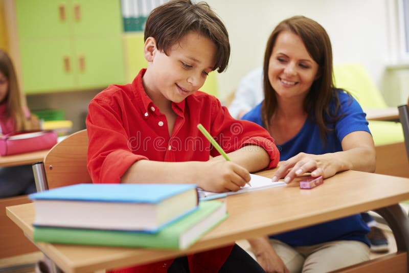 Insegnante con l'allievo fotografia stock