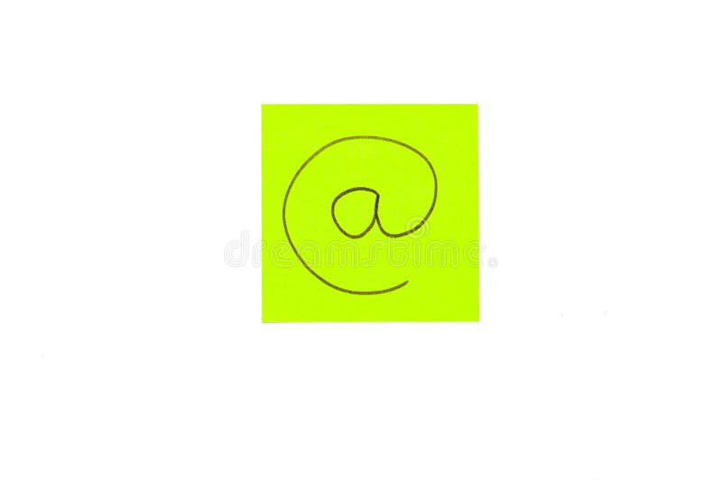 A post it on white background with an at symbol on it. A post it on white background with an at symbol on it