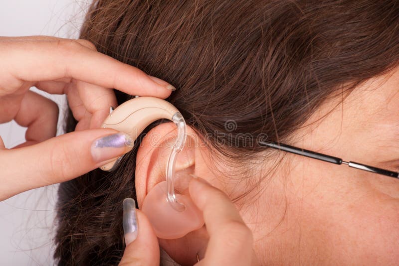 Inserting a hearing aid