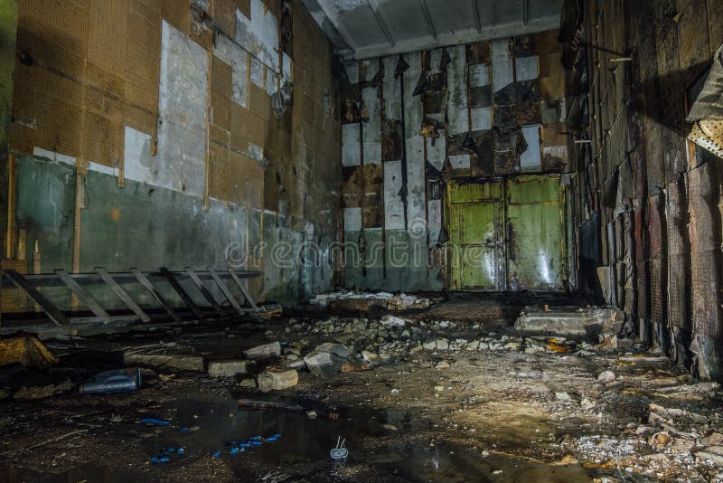 Inside abandoned machine hangar or warehouse waiting for demolition stock images
