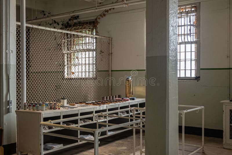 San Francisco, CA, USA - July 12, 2023: Inside historic Alcatraz prison. Personal hygiene section, collection of items exposed on low cabinet. San Francisco, CA, USA - July 12, 2023: Inside historic Alcatraz prison. Personal hygiene section, collection of items exposed on low cabinet