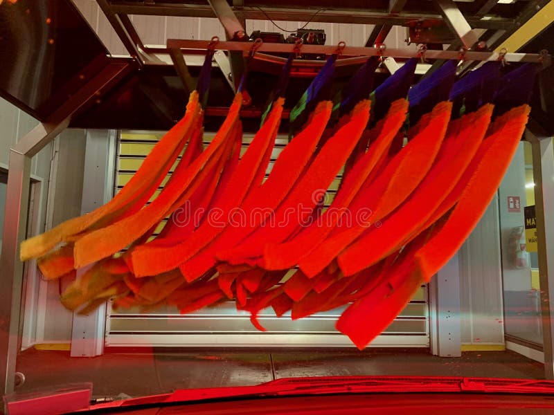 Inside Automatic Conveyorized Tunnel Car Wash. View from Inside Car