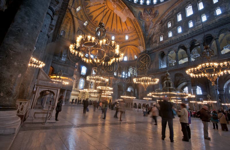 Inside the Aya Sofia museum, Istanbul, Turkey. Showing the domes, lights, decoration and tourists. Inside the Aya Sofia museum, Istanbul, Turkey. Showing the domes, lights, decoration and tourists.