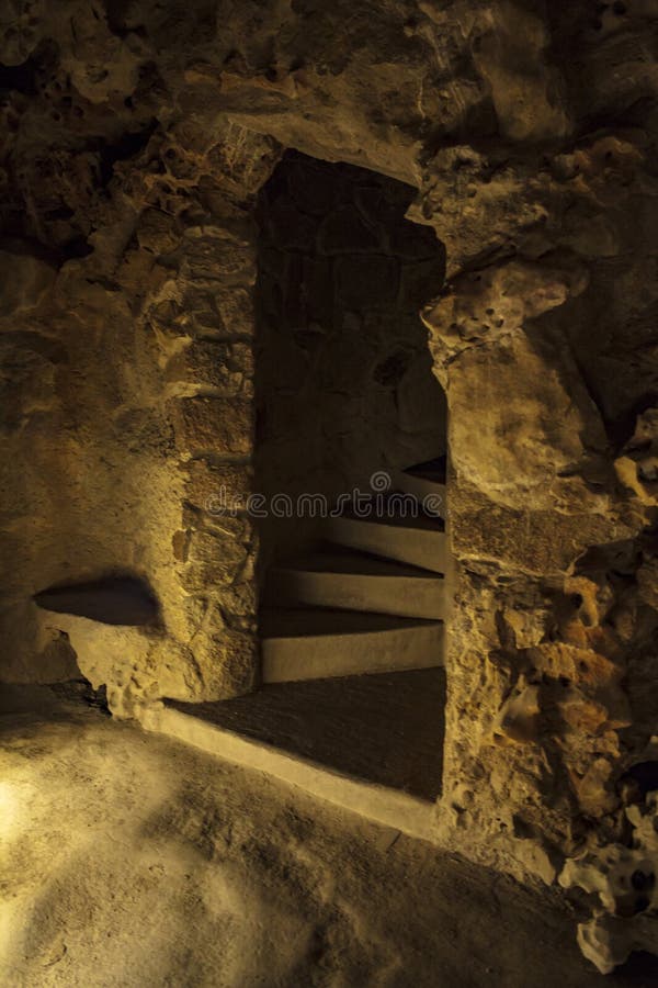 Inside a cave, wall and door with stairs