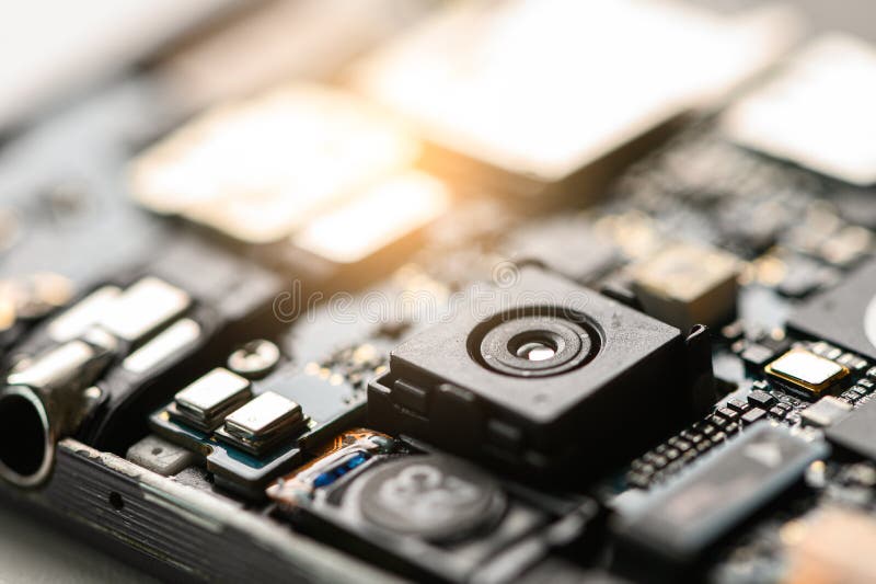 The inside of the smartphone`s motherboard and sim card lay on the back table. the concept of computer hardware, mobile phone, el royalty free stock photography
