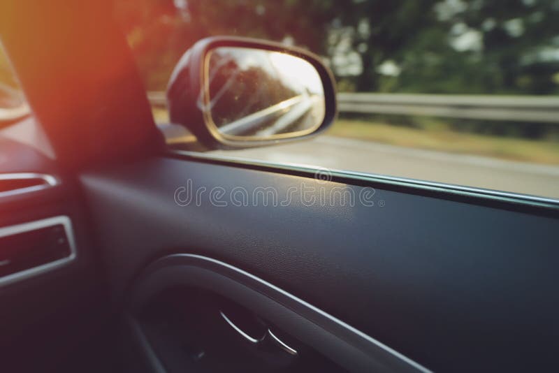 Inside View on Door Panel and Passenger Side Window of a Fast Moving Modern Uppermiddle Class