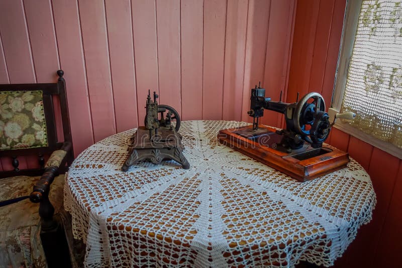 Inside view of old sewing machine over a wooden table at Chonchi museum exposition royalty free stock photos