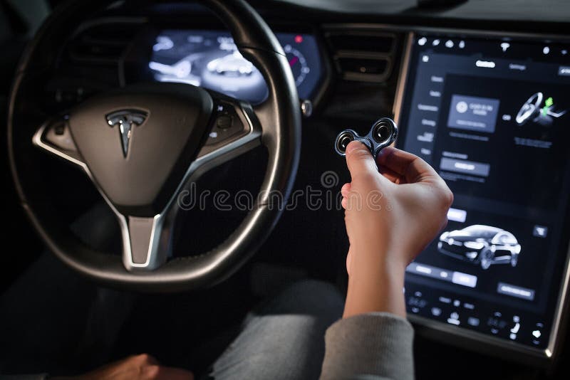 Inside View of Tesla Electric Vehicle. Sreering Wheel and Displays