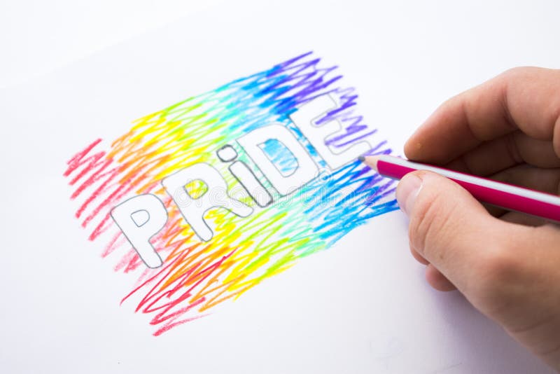 Inskriftstolthet målade i färgerna av regnbågen Dag av bögen Pride Month