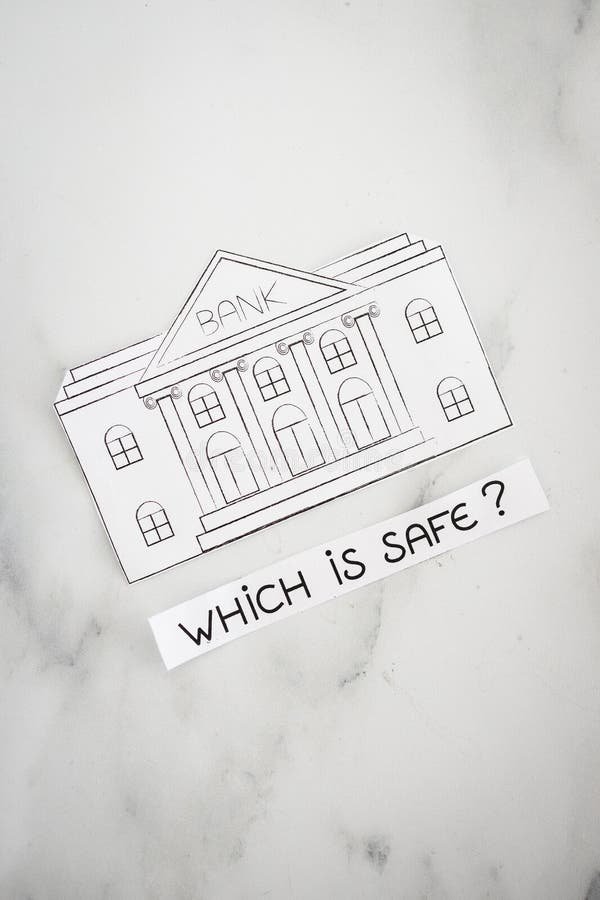Insolvency and banks closing down concept, bank made of paper with Which is Safe caption underneat stock images Insolvency and banks closing down concept, bank made of paper with Which is Safe caption underneat stock images
