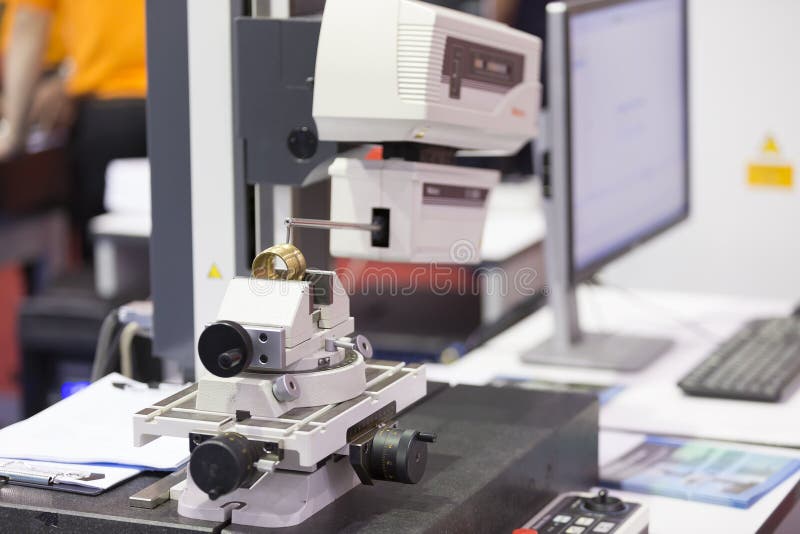 Inspection automotive part by contour measuring machine stock photography