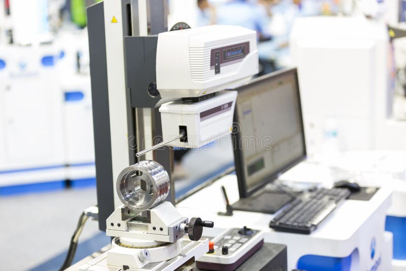 Inspection automotive part by contour measuring machine royalty free stock photography