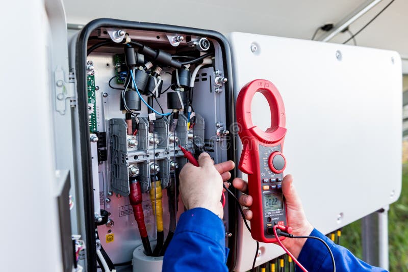 The Inspector Checks the Actual Output Voltage Level of Inverter Stock