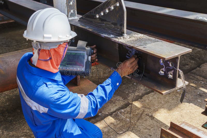 Inspectors are Checking Defects in Welded Steel Hbeam Add Joint with