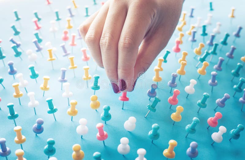 Inspiration creativity concepts with woman hand push pin,thumbtack on blue background royalty free stock photos Inspiration creativity concepts with woman hand push pin,thumbtack on blue background royalty free stock photos