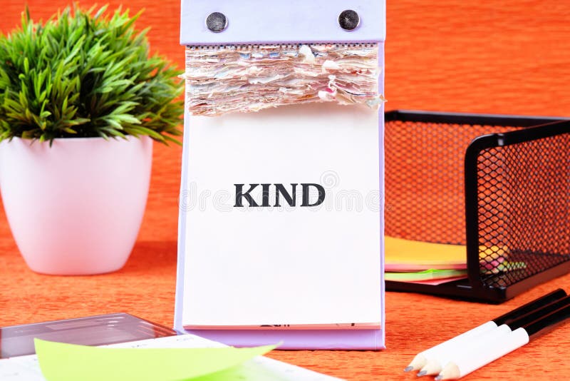 An Inspirational Calendar Features the Word Kind Prominently Displayed