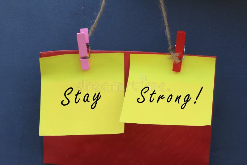 Inspirational quote - Stay strong. With origami paper notes hanging on wall. Encouragement concept with colorful creative papers. stock images Inspirational quote - Stay strong. With origami paper notes hanging on wall. Encouragement concept with colorful creative papers. stock images