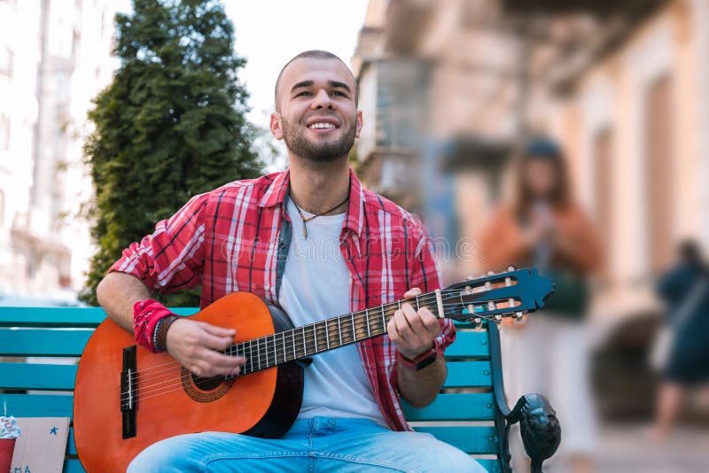 Inspired street musician bringing music on street stock images Inspired street musician bringing music on street stock images