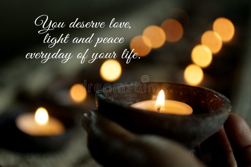 Inspirational quote - You deserve love, light, peace everyday of your life. Self love care and worthy concept with person holding a candle light on bokeh candles lights background. Inspirational quote - You deserve love, light, peace everyday of your life. Self love care and worthy concept with person holding a candle light on bokeh candles lights background