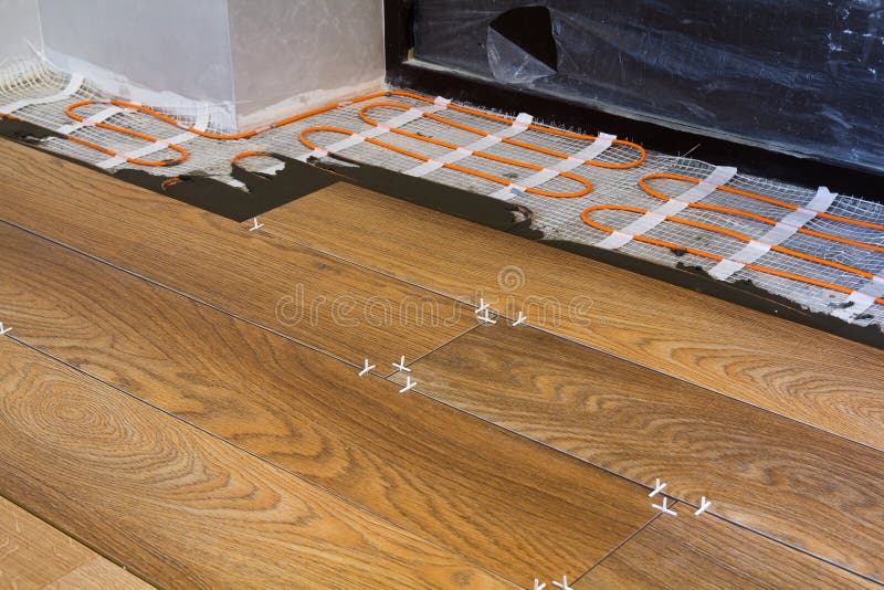 Installation of Ceramic Tiles and Heating Elements in Warm Tile Floor