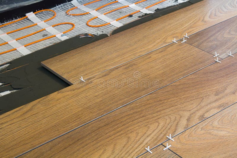 Installation of Ceramic Tiles and Heating Elements in Warm Tile Floor