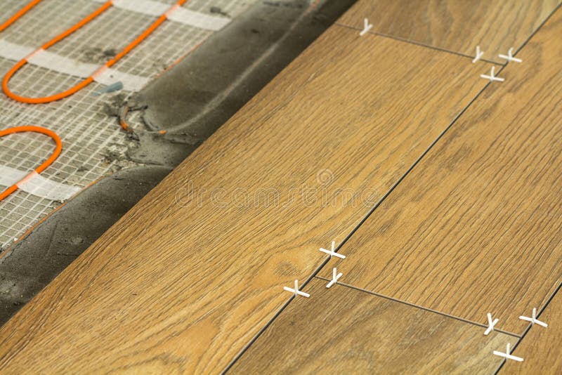 Installation of Ceramic Tiles and Heating Elements in Warm Tile Stock