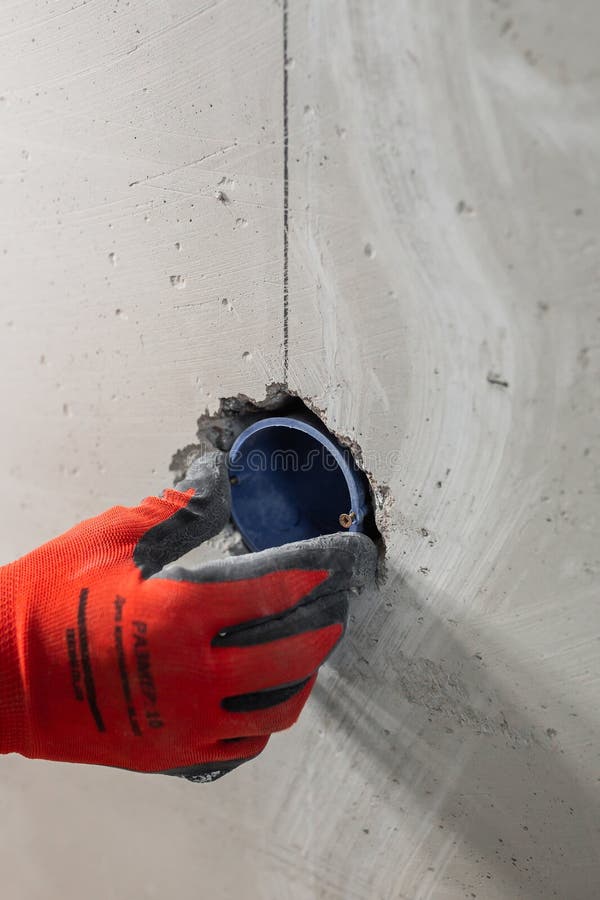 Installation of Electrical Outlets in a Concrete Wall Stock Photo