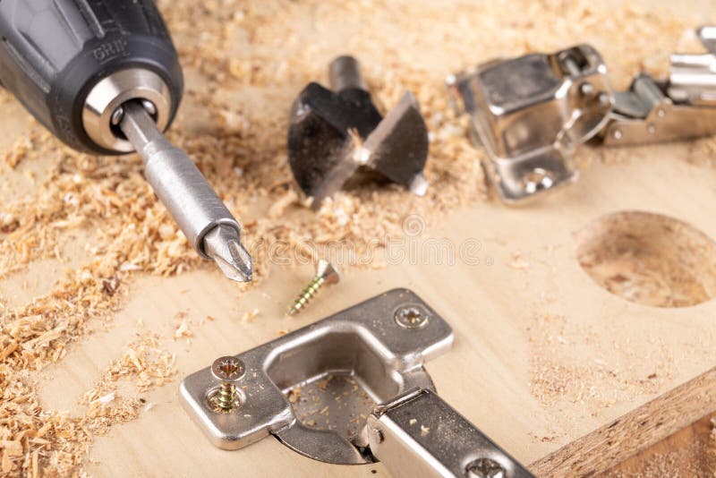 Installation of Furniture Hinges in Chipboard. Small Carpentry Work in