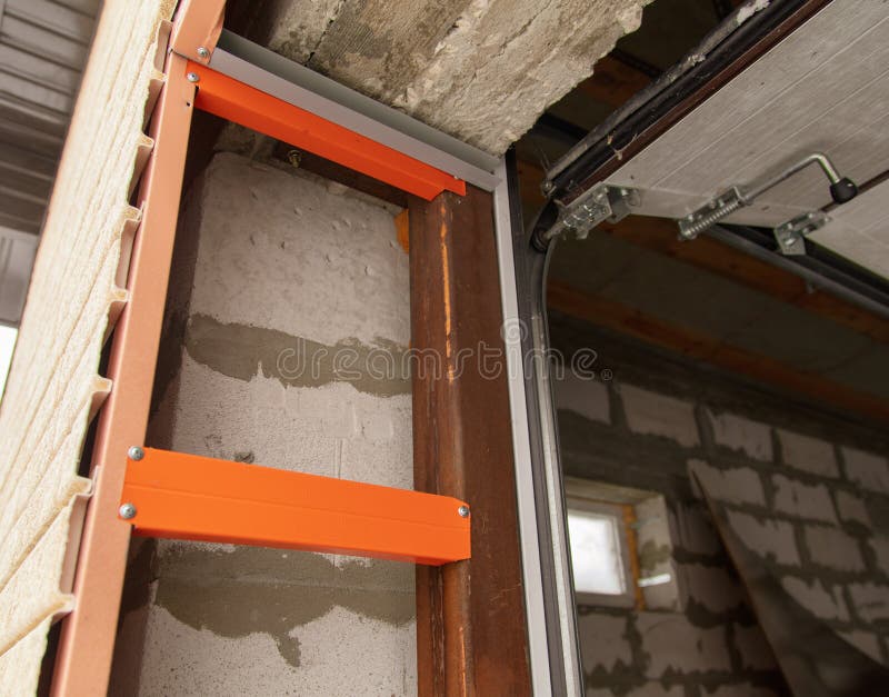 Installation of the gate in the garage metal stock photography