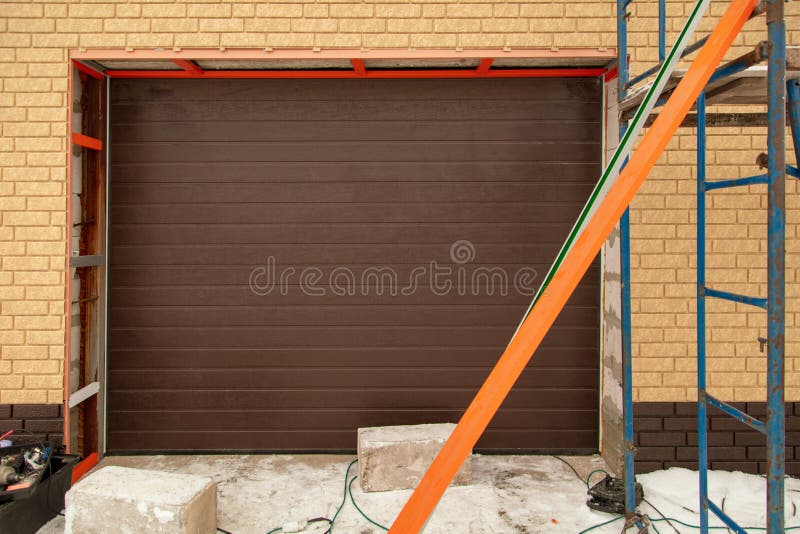 Installation of the gate in the garage metal royalty free stock photography