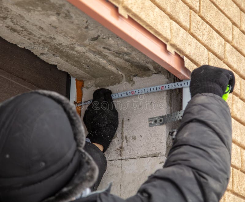 Installation of the gate in the garage metal stock image