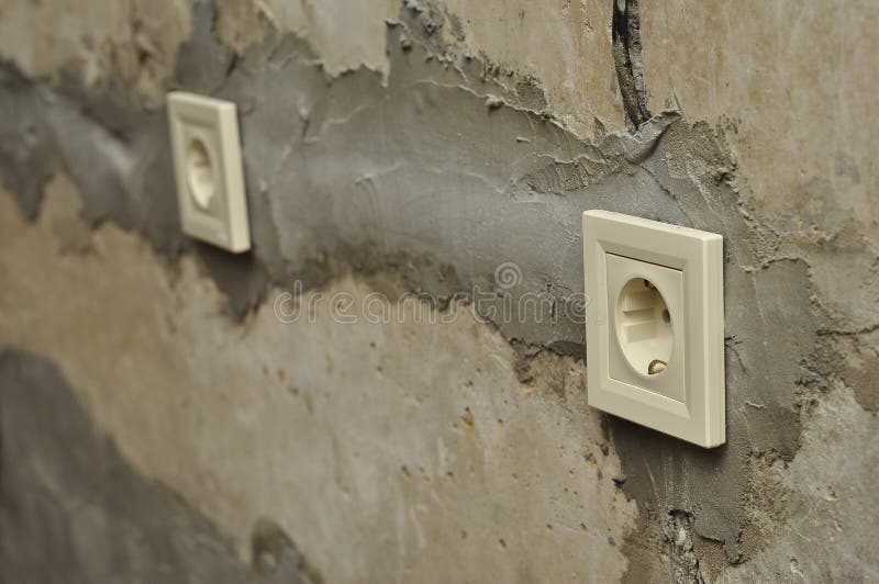 Installation of Outlets during Repair in Fresh Concrete Empty Walls
