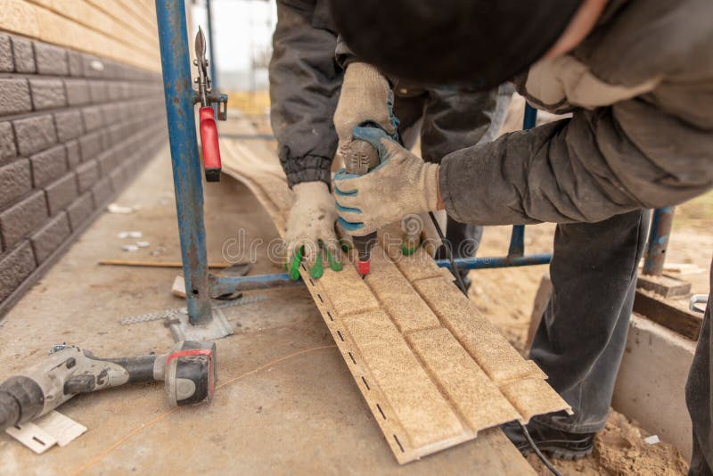 Installation of Plastic Siding Under the Brick Stock Photo Image of