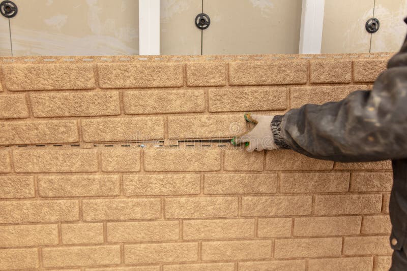 Installation of Plastic Siding Under the Brick Stock Photo Image of