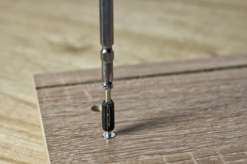 Installation in the socket with the help of a threaded furniture fastener tool. Installation in the socket of the threaded furniture fastener