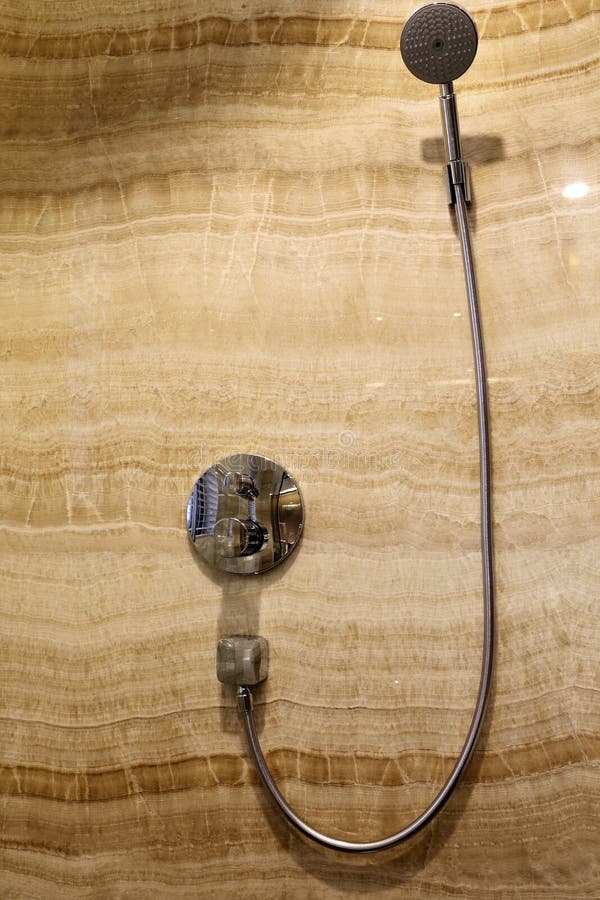 Marble wall switches and hose, bright and clean, the bathroom reflection to the switch. Marble wall switches and hose, bright and clean, the bathroom reflection to the switch