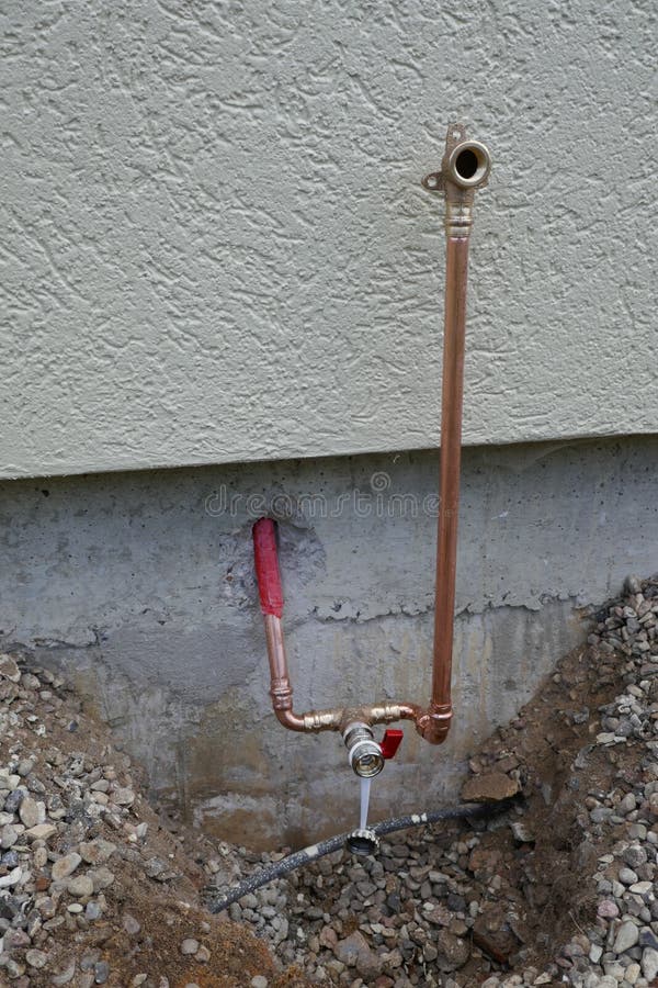 Installation of an outdoor tap on a house wall
Faucet on a house wall with adapter for a garden hose. Germany, Europe. Installation of an outdoor tap on a house wall
Faucet on a house wall with adapter for a garden hose. Germany, Europe