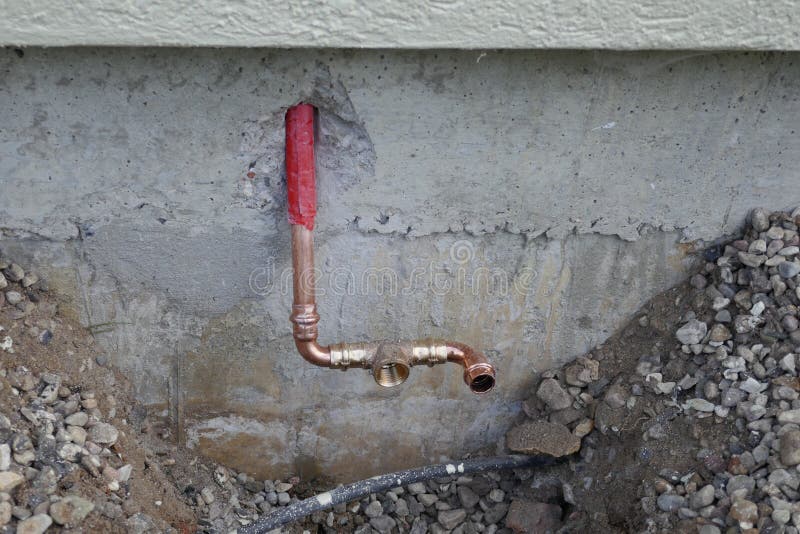 Installation of an outdoor tap on a house wall
Faucet on a house wall with adapter for a garden hose. Germany, Europe. Installation of an outdoor tap on a house wall
Faucet on a house wall with adapter for a garden hose. Germany, Europe