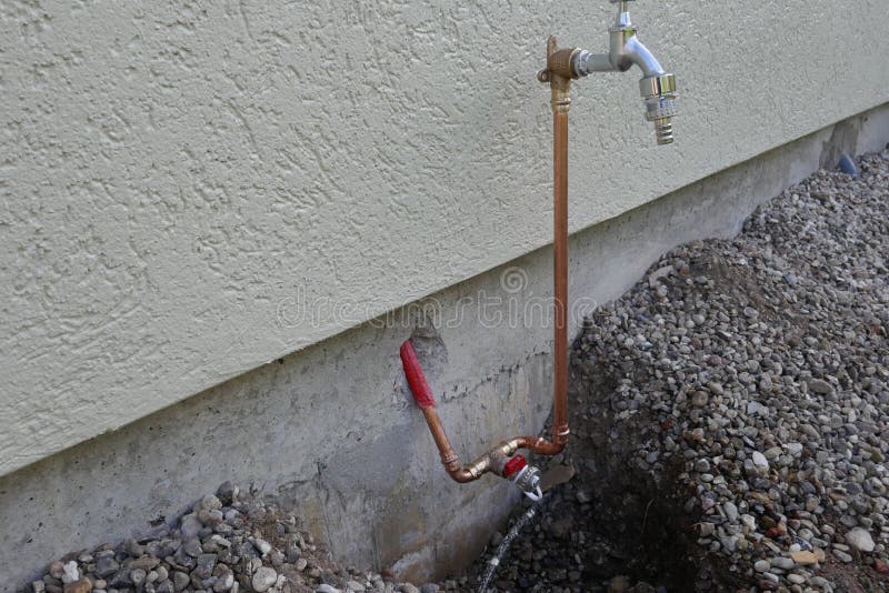 Installation of an outdoor tap on a house wall
Faucet on a house wall with adapter for a garden hose. Germany, Europe. Installation of an outdoor tap on a house wall
Faucet on a house wall with adapter for a garden hose. Germany, Europe